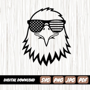 May include: A black and white graphic illustration of a bald eagle head wearing sunglasses. The left lens of the sunglasses features a star pattern, while the right lens features a striped pattern. Below the eagle, the text reads DIGITAL DOWNLOAD SVG PNG JPG PDF.