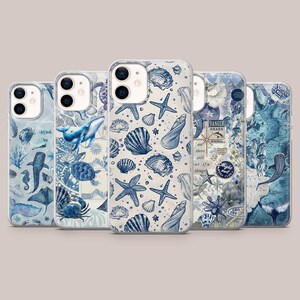 May include: Five clear phone cases featuring blue and white marine-themed designs. The patterns include illustrations of whales, sea turtles, crabs, starfish, seashells, and jellyfish, along with nautical map elements and text like Night Owl Book Club.