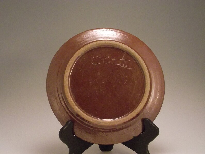 Brown plate with bronze hi lights perfect with cheese and crackers