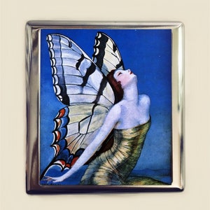 May include: A vintage illustration of a woman with butterfly wings against a blue background. The woman is wearing a gold dress and has her head tilted back. The butterfly wings are white with black and red markings.
