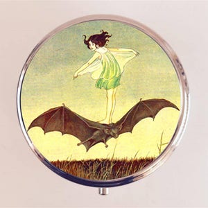 Bat Rider Pill Box Case Pillbox Holder Trinket Little Girl Riding Bat Illustration Storybook Goth
