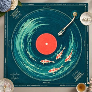 May include: A square dark teal mahjong mat featuring a central vinyl record graphic with a red center, swirling teal water patterns, and three white and red koi fish. A gold record player tonearm is positioned on the top right. Text includes Charleston, Jokers, and game rules.