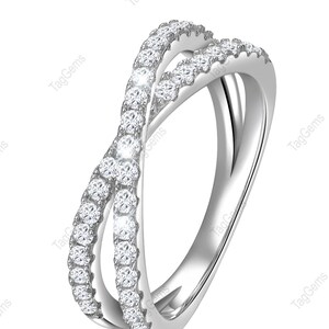 May include: A silver-toned crossover ring featuring two intersecting bands. One band is encrusted with a continuous row of small, round, clear, faceted stones, while the other band remains a smooth, polished, solid silver-toned metal finish.