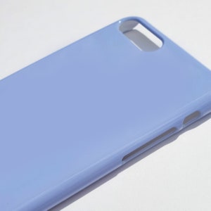 May include: A light blue phone case with a smooth, glossy finish.