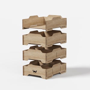 May include: A four-tier stackable wooden document tray organizer with a light oak finish. Each tray features open sides and a notched design. The bottom tray displays a small black logo with the letter W on the front panel.