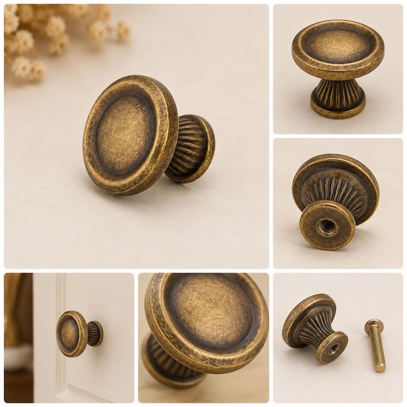 May include: A round cabinet knob with an antique brass finish featuring a smooth, flat circular face and a fluted, tapered base. The hardware includes a threaded center hole for attachment and a matching metal screw for installation purposes.