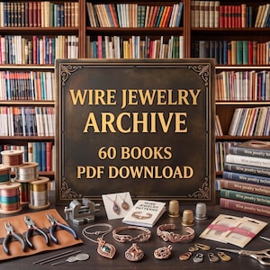 May include: A dark brown sign with gold text reading WIRE JEWELRY ARCHIVE 60 BOOKS PDF DOWNLOAD. The display includes spools of colored wire, metal pliers, a small vise, thimbles, wire-wrapped jewelry pieces, and a stack of books.