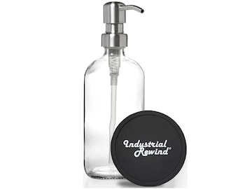 May include: A clear glass soap dispenser with a stainless steel pump and a black lid with the text "Industrial Rewind" printed in white.
