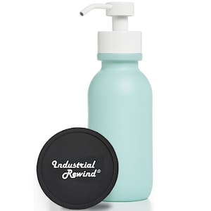 May include: A pale blue soap dispenser with a white pump and a black coaster. The coaster has the text "Industrial Rewind" in white script. The dispenser is a cylindrical shape.