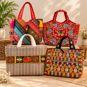 May include: Four tote bags featuring vibrant embroidery and fabric patterns. One bag has diagonal stripes with tassels, one is red with an elephant motif, one is gray with a horizontal elephant band, and one has a colorful geometric pattern.