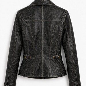 May include: A black jacket with a distressed, weathered texture, featuring a collared neckline, long sleeves with buttoned cuffs, and a fitted waist with decorative side tabs accented by gold-toned metal buttons, shown from the back view.