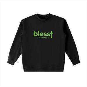 May include: A black long-sleeve crewneck sweatshirt featuring the text "blesst" in lime green, with the letter "t" stylized as a cross. Below the word "blesst," the text "CLOTHING CO." is printed in a smaller, lime green font.