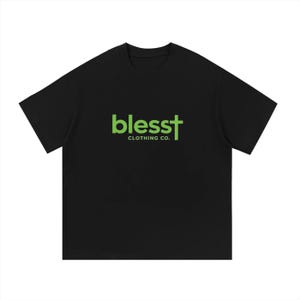 May include: A black short-sleeved t-shirt featuring the text "blesst" in lime green, with the letter "t" stylized as a cross. Below the word "blesst," the text "CLOTHING CO." is printed in a smaller, matching lime green font on the chest.