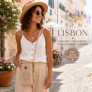 May include: A beige crochet crossbody phone purse featuring a circular mandala-style pattern and a single wooden button closure. The bag includes a long matching strap with a small tassel detail. Text reads LISBON CROCHET CROSSBODY PHONE PURSE PATTERN.