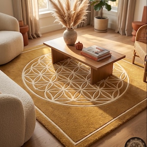May include: A rectangular area rug in a deep mustard yellow color featuring a large, centered white geometric flower of life pattern. The rug has a thick, textured pile and a simple white border frame. The brand name Farshich is visible in the corner.