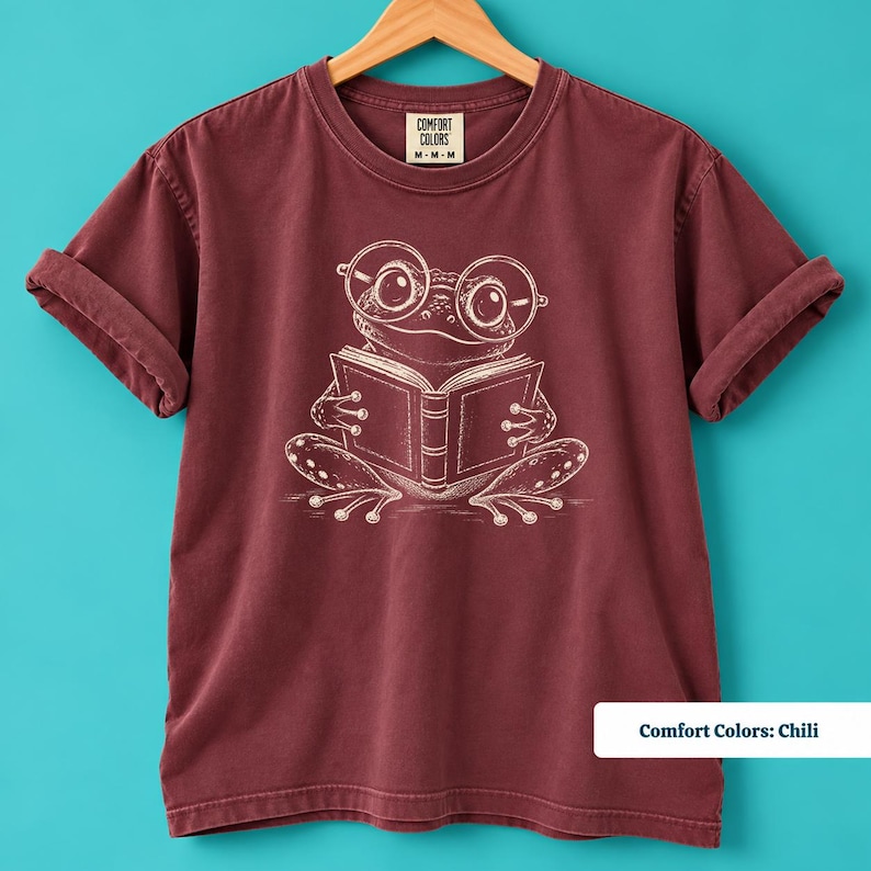 Book club sweatshirt with a cute sketch style frog wearing oversized round glasses and reading a book, cute frog shirt, book lover shirt, reading shirt, frog reading shirt, bookish shirt, book club shirt, library shirt, book lover gift, frog lover gift, frog sweatshirt, bookish sweatshirt, comfort colors shirt, bookworm gift, reader shirt, cute reading tee, book club gift, librarian shirt, frog lover shirt, bookish gift