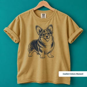A corgi shirt and corgi merchandise design centered around an adorable corgi with glasses and a nerdy vintage personality. This geeky corgi shirt blends retro corgi shirt style with the charm of a nerdy dog shirt, making it a fun corgi mom shirt or dog lover gift.