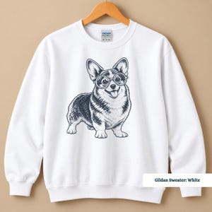 A corgi shirt and corgi merchandise mockup showcasing a cute glasses-wearing corgi with plenty of nerdy personality. The corgi glasses shirt has a vintage dog tee feel that blends naturally with retro corgi shirt and geeky corgi shirt style for a fun dog lover look.
