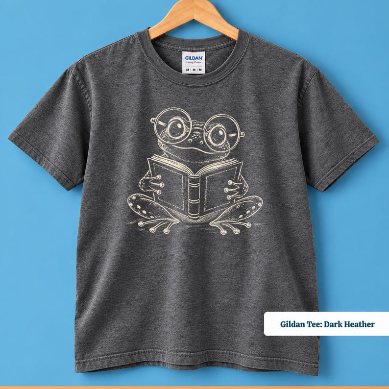 Book club sweatshirt for readers with a charming sketch frog wearing oversized eyeglasses and holding an open book, cute frog shirt, book lover shirt, reading shirt, frog reading shirt, bookish shirt, book club shirt, library shirt, book lover gift, frog lover gift, frog sweatshirt, bookish sweatshirt, comfort colors shirt, book club gift, bookworm shirt, reader gift, librarian gift, cute frog gift, reading lover shirt, bookish gift