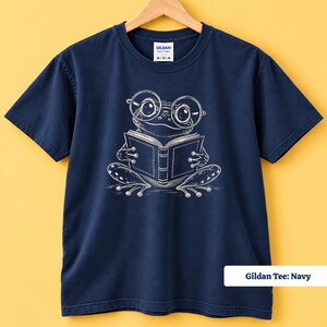 Reading shirt featuring a cute whimsical frog drawn in a loose sketch style with oversized glasses and an open book, cute frog shirt, book club sweatshirt, book lover shirt, frog reading shirt, bookish shirt, book club shirt, library shirt, book lover gift, frog lover gift, frog sweatshirt, bookish sweatshirt, comfort colors shirt, reading lover gift, bookworm shirt, reader gift, librarian gift, book club gift, cute bookish frog shirt