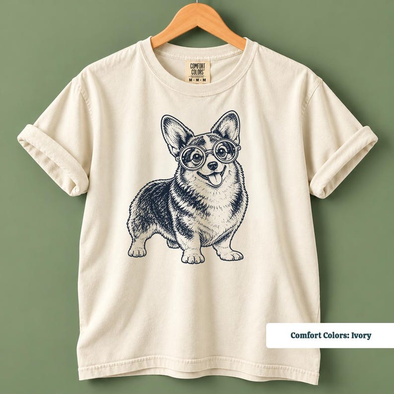 This corgi shirt and corgi merchandise mockup features a cute corgi wearing glasses with a playful vintage inspired appearance. The corgi glasses shirt combines geeky corgi style, retro dog artwork, and vintage corgi shirt appeal for corgi moms and dog lovers.