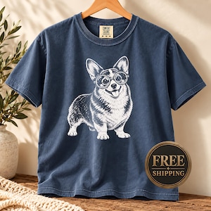 A corgi shirt and corgi merchandise mockup featuring a playful corgi with glasses, perfect for fans of vintage corgi shirts and geeky corgi style. This nerdy dog shirt has a fun retro feel that works as a corgi mom shirt, vintage dog tee, or unique corgi lover gift.