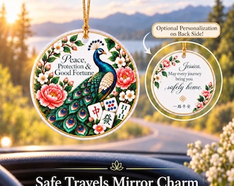 May include: A round ceramic car ornament featuring a peacock, mahjong tiles, and pink flowers with the text Peace, Protection & Good Fortune. The reverse side shows the text Jessica, May every journey bring you safely home and Chinese characters.
