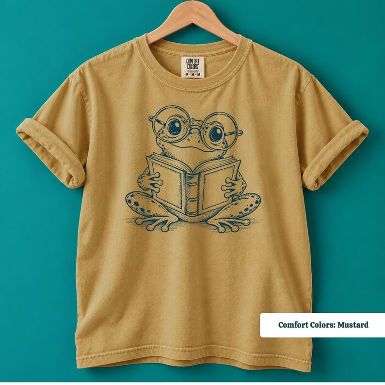 Library shirt with an adorable sketch style frog wearing nerdy round glasses and reading a book, cute frog shirt, book club sweatshirt, book lover shirt, reading shirt, frog reading shirt, bookish shirt, book club shirt, book lover gift, frog lover gift, frog sweatshirt, bookish sweatshirt, comfort colors shirt, librarian shirt, librarian gift, reader shirt, bookworm gift, reading lover gift, cute frog tee, bookish reader gift