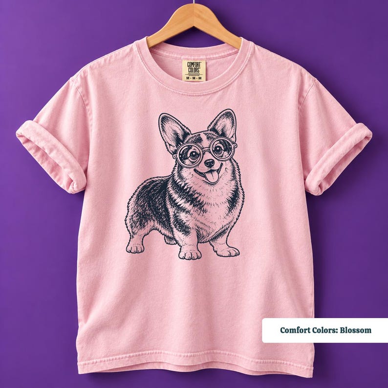 A corgi shirt and corgi merchandise design featuring an expressive corgi with glasses in a quirky retro aesthetic. This vintage corgi shirt works perfectly for fans of geeky corgi shirts and corgi nerd shirts while giving the classic vintage dog tee a playful new personality.