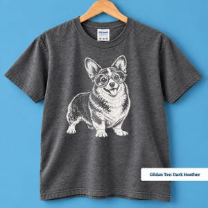 This corgi shirt and corgi merchandise mockup showcases a cute corgi with glasses and a quirky geeky personality. The vintage corgi shirt design has a playful retro feel that works beautifully as a corgi nerd shirt, nerdy dog shirt, vintage dog tee, or corgi lover gift.