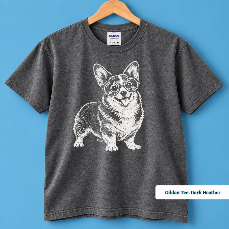 This corgi shirt and corgi merchandise mockup showcases a cute corgi with glasses and a quirky geeky personality. The vintage corgi shirt design has a playful retro feel that works beautifully as a corgi nerd shirt, nerdy dog shirt, vintage dog tee, or corgi lover gift.