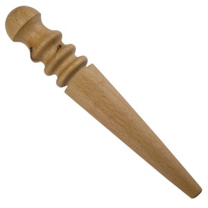 May include: A wooden leather stitching tool with a rounded handle and a tapered point.