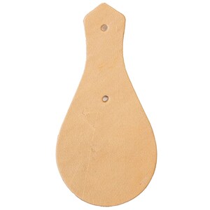 May include: A light brown leather teardrop-shaped patch with two holes for stitching.