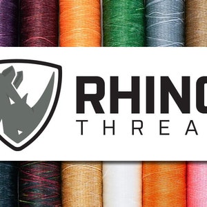 May include: A variety of spools of waxed thread in different colors, including teal, black, red, white, orange, pink, and purple. The spools are arranged in a row and feature the logo "RHINO THREAD" with a rhinoceros silhouette.
