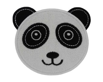 Fer d’ours de panda sur l’applique de correction