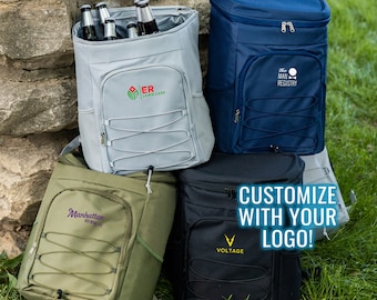 May include: Four different insulated cooler backpacks with custom logos. The backpacks are in various colors, including gray, blue, green, and black. The logos are "ER Lawn Care", "The Man Registry", "Manhattan Brewing Co.", and "Voltage".