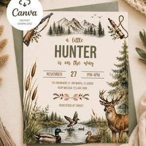 May include: A rectangular baby shower invitation card featuring a watercolor illustration of a mountain landscape, a deer, and ducks in a pond. The text reads: a little HUNTER is on the way, NOVEMBER 27 1PM-4PM, 123 ANYWHERE ST. ANYWHERE, FL 00000, RSVP MELISSA 123.456.7890, REGISTERED @ TARGET.