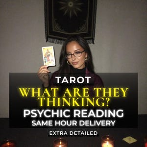 May include: A tarot card held up by a person wearing glasses, with text overlay reading: TAROT WHAT ARE THEY THINKING? PSYCHIC READING SAME HOUR DELIVERY EXTRA DETAILED. The scene includes lit candles on a dark surface and a wall hanging.