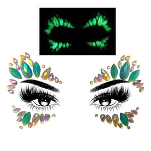 May include: Green and iridescent face jewels with a glow-in-the-dark effect. The jewels are arranged in a leaf-like pattern around the eyes.