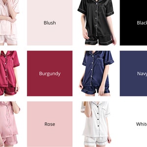 May include: A set of ten different color satin pajamas. The pajamas feature a short-sleeved button-up top and matching shorts. The colors are blush, black, burgundy, navy, rose, and white.