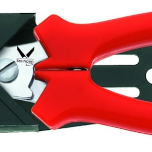 May include: Red handled wire cutters with a black metal body and a silver blade. The cutters have a small hole for hanging.