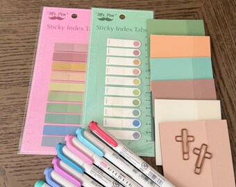 May include: A collection of stationery items including two packs of Mr. Pen sticky index tabs in pink and green, a stack of assorted pastel sticky notes, two rose gold paper clips, and five double-ended Mildliner highlighters in pastel colors.
