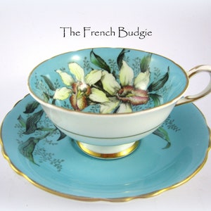 COLLECTIBLE RARE Paragon Double Warrant  Beautiful Turquoise Blue Vintage Teacup with White and Pink Orchids Made in ENGLAND Tea Cup