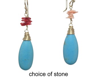 May include: Turquoise teardrop earrings with a choice of coral or pink stone accents. The earrings are made with gold wire and silver hooks.