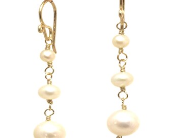 Dangle ivory freshwater pearl earrings Cosmopolitan 11