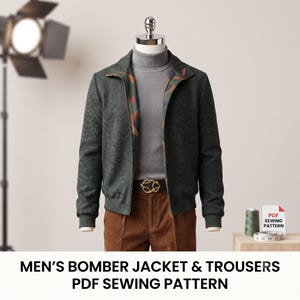 May include: A dark green bomber jacket with a patterned inner lining, worn over a grey turtleneck sweater and brown trousers with a gold-toned belt buckle. A spool of green thread and a white measuring tape sit next to a PDF sewing pattern sign.