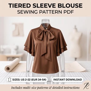 Könnte beinhalten: Eine braune Bluse mit gestuften Ärmeln und einer Schleife am Kragen, präsentiert auf einer Schaufensterpuppe. Text: TIERED SLEEVE BLOUSE SEWING PATTERN PDF, SIZES: US 2-22 (EUR 34-54), INSTANT DOWNLOAD, Includes multi-size patterns & detailed instructions.