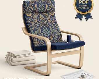 Puede incluir: Un sillón de madera clara con una funda azul marino con un patrón de pájaros y follaje. Incluye una pila de tela, un carrete de hilo, una cinta métrica y un patrón de costura en PDF con un sello dorado que dice PDF SEWING PATTERN.