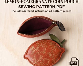 May include: A lemon-pomegranate coin pouch sewing pattern PDF with detailed instructions and pattern pieces. The image shows a closed, orange, fruit-shaped pouch with a gold pomegranate line drawing and a green leaf, and an open pouch with a purple interior.