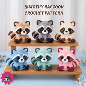 May include: Six crocheted raccoon plushies in tan, grey, cream, blue, mint, and pink, each with black eye patches and striped tails. The text reads JIMOTHY RACCOON CROCHET PATTERN and NO SEW. The plushies are arranged on a two-tiered wooden stand.
